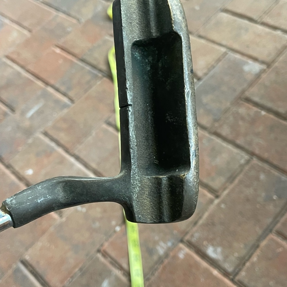 Hallmark 7 vintage golf putter in right hand